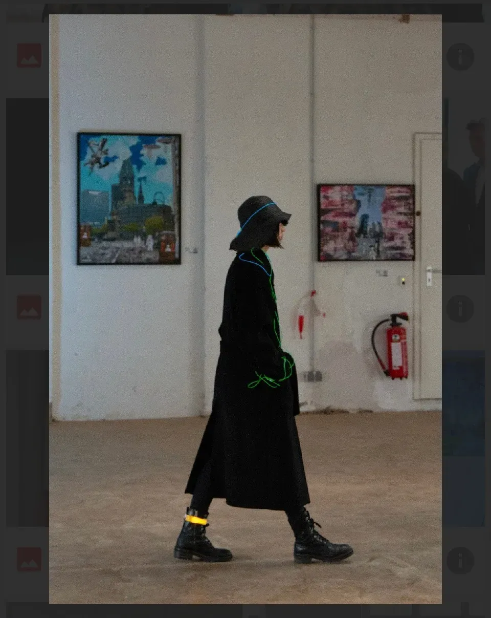 A time traveller moves through the exhibition space